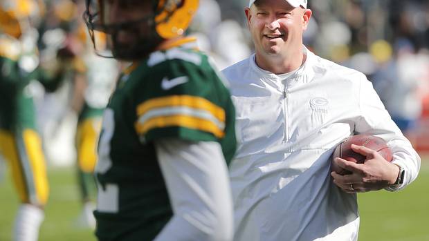Green Bay Packers offensive coordinator Nathaniel Hackett talks with quarterback Aaron Rodgers (12) before their game against the Oakland Raiders Sunday, October 21, 2019 at Lambeau Field in Green Bay, Wis.