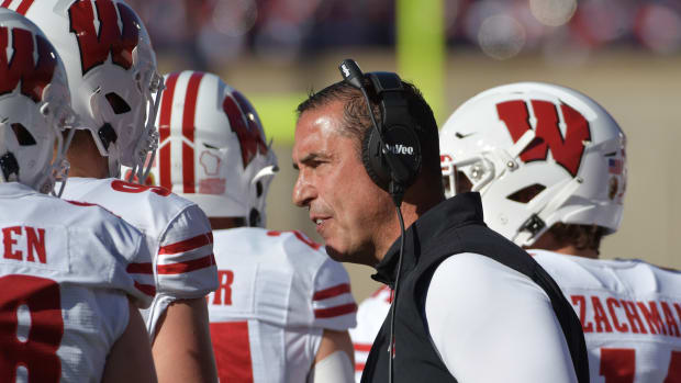 Wisconsin Badgers head coach Luke Fickell talks to his players during the first half against the Illinois Fighting Illini at Memorial Stadium.