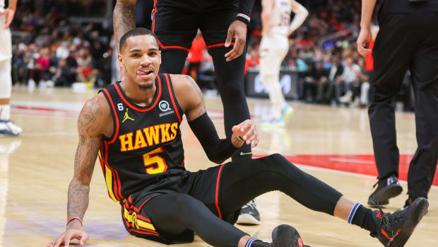 Atlanta Hawks guard Dejounte Murray smiles after being fouled.