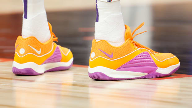 Phoenix Suns forward Kevin Durant's orange and purple Nike sneakers.
