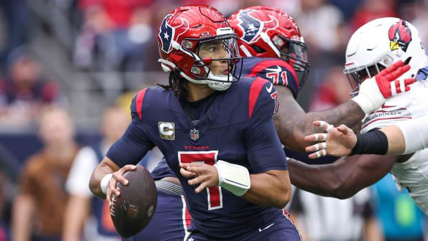 Nov 19, 2023; Houston, Texas, USA; Houston Texans quarterback C.J. Stroud (7) looks for an open receiver during the game against the Arizona Cardinals at NRG Stadium. Mandatory Credit: Troy Taormina-USA TODAY Sports