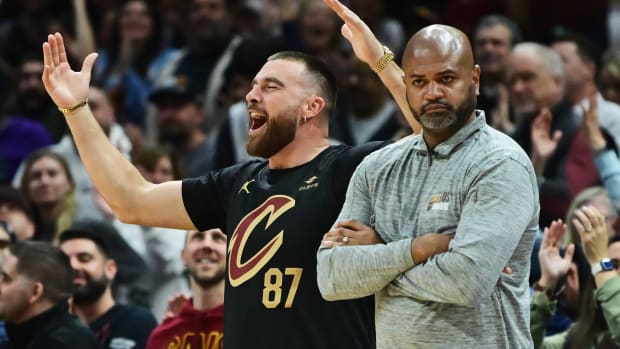 Travis Kelce cheers on the sidelines during a Cleveland Cavaliers game.