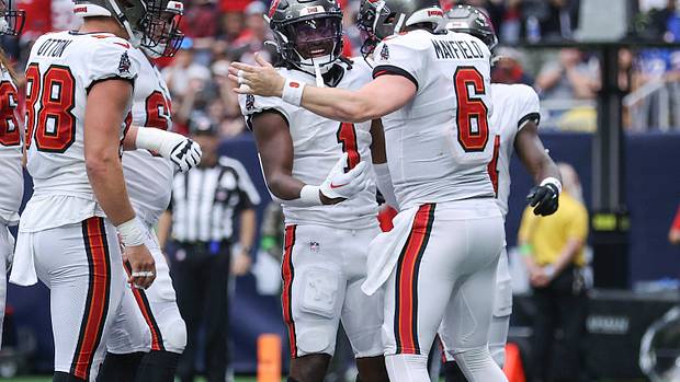 Tampa Bay Buccaneers running back Rachaad White (1) and quarterback Baker Mayfield (6) celebrate after a touchdown during the second quarter against the Houston Texans at NRG Stadium.