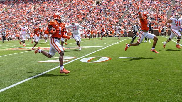 Clemson Tigers safety Andrew Mukuba runs with the ball.