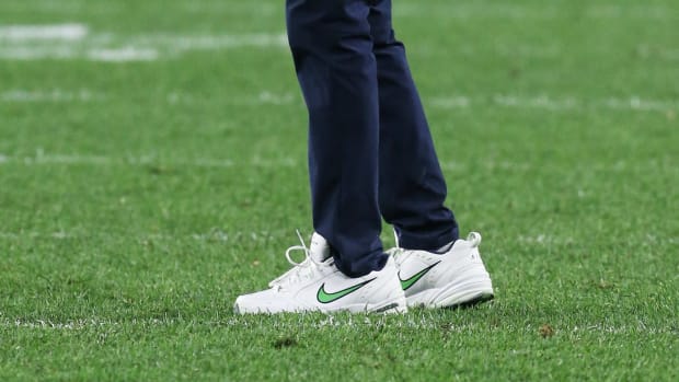 Seattle Seahawks head coach Pete Carroll's white and green Nike sneakers.
