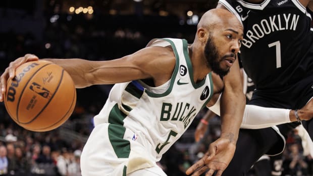 Milwaukee Bucks guard Jevon Carter (5) drives for the basket during the first quarter against the Brooklyn Nets