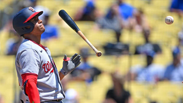 Juan Soto flips his bat.