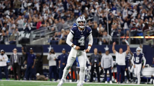Dallas Cowboys quarterback Dak Prescott reacts to throwing a touchdown pass.