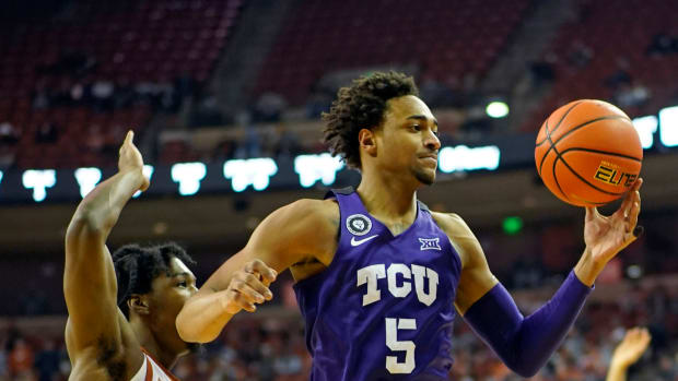 Feb 23, 2022; Austin, Texas, USA; Texas Christian Horned Frogs forward Chuck O'Bannon Jr. (5) tries to control the ball while defended by Texas Longhorns guard Marcus Carr (2) during the second half at Frank C. Erwin Jr. Center. Mandatory Credit: Scott Wachter-USA TODAY Sports