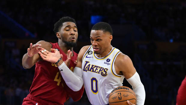 Los Angeles Lakers guard Russell Westbrook (0) is defended by Cleveland Cavaliers guard Donovan Mitchell (45) as he drives to the basket in the second half at Crypto.com Arena.