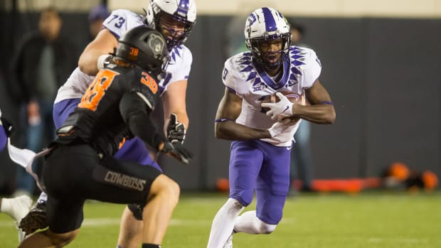 Nov 13, 2021; Stillwater, Oklahoma, USA; TCU Horned Frogs running back Ahmonte Watkins (19) runs the ball during the fourth quarter against the Oklahoma State Cowboys at Boone Pickens Stadium. Mandatory Credit: Brett Rojo-USA TODAY Sports