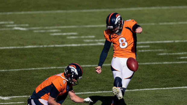 Denver Broncos kicker Brandon McManus (8) practices field goals as punter Sam Martin (6) holds the ball before the game against the Miami Dolphins at Empower Field at Mile High.