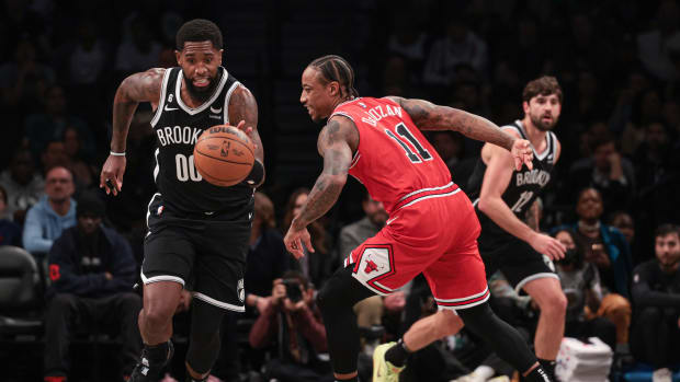 Bulls forward DeMar DeRozan attempts to stop a Nets fast break.
