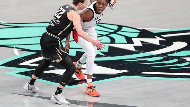 Las Vegas Aces guard Chelsea Gray dribbles past New York Liberty guard Courtney Vandersloot.