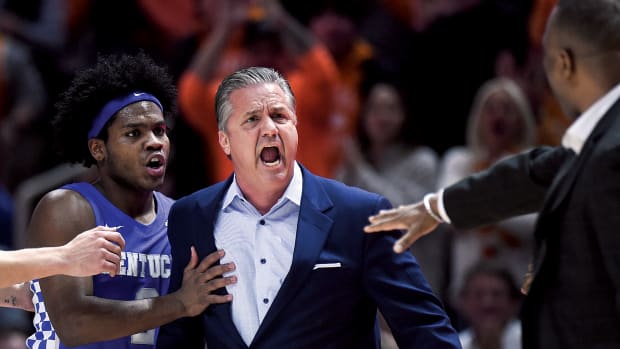 Kentucky head coach John Calipari reacts after a technical foul was called against him during the NCAA college basketball game between the Kentucky Wildcats and Tennessee Volunteers in Knoxville.