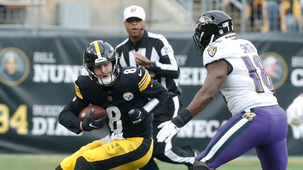 Pittsburgh Steelers quarterback Kenny Pickett (8) is sacked by Baltimore Ravens linebacker Roquan Smith (18) during the first quarter at Acrisure Stadium.
