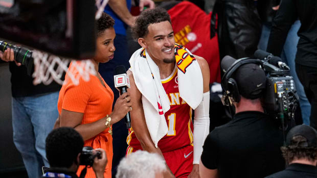 Trae Young smiles during a post-game interview in Atlanta.