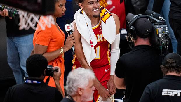Trae Young smiles during a post-game interview in Atlanta.