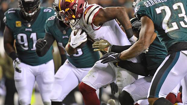 Washington Commanders running back Brian Robinson Jr. carries the ball against the Philadelphia Eagles.