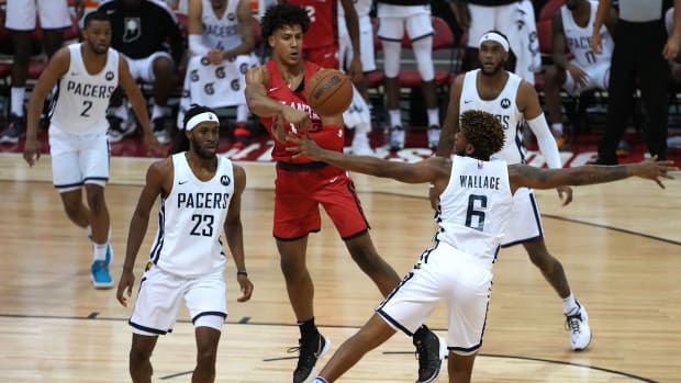 Atlanta Hawks forward Jalen Johnson (1) against Indiana Pacers forward Isaiah Jackson (23) and Indiana Pacers guard Tyrone Wallace (6) during an NBA Summer League game at Cox Pavilion.