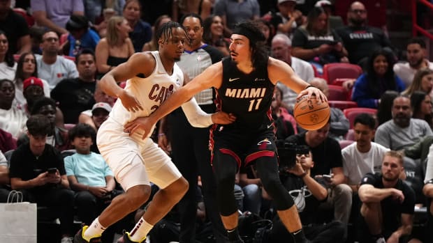 Dec 8, 2023; Miami, Florida, USA; Miami Heat guard Jaime Jaquez Jr. (11) dribbles the ball around Cleveland Cavaliers forward Isaac Okoro (35) during the second half at Kaseya Center.