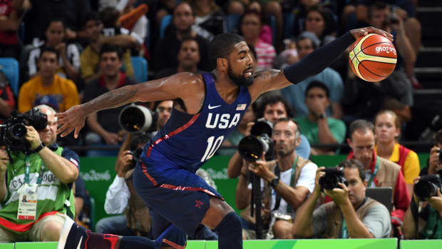 USA guard Kyrie Irving grabs a loose ball during the 2016 Summer Olympic Games.
