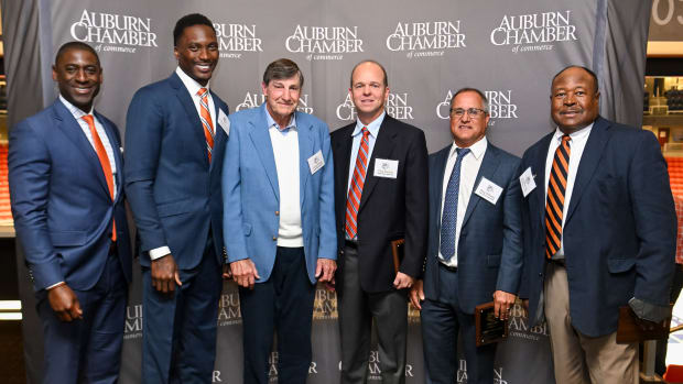 Auburn Dir. of Athletics Allen Greene talks a picture with Marquis Daniels, Jimmy Dozier, Chip Spratlin, Greg Williams and Joe Whitt.Also honored but not present were Emily Carosone, Softball 2013-2016, Kristy Coventry, Swimming 2002-2005 and Stan White, Football 1990-1993,Auburn Tiger Trail program on Friday. April 8, 2022 in Auburn, Ala.