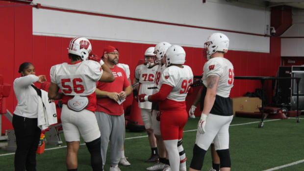 Ross Kolodziej speaking with the defensive line.