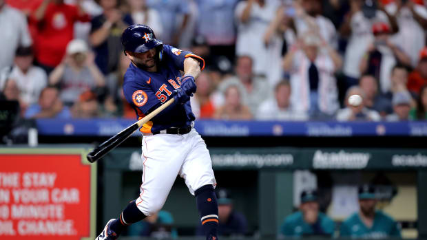 Aug 19, 2023; Houston, Texas, USA; Houston Astros second baseman Jose Altuve (27) hits a single to left field against the Seattle Mariners during the fifth inning at Minute Maid Park. The hit is the 2,000th of Altuve's career. Mandatory Credit: Erik Williams-USA TODAY Sports  