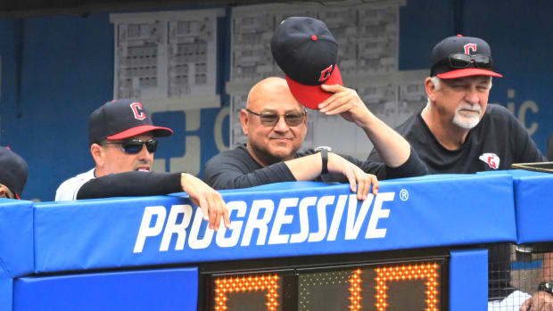 Jun 11, 2023; Cleveland, Ohio, USA; Cleveland Guardians third base coach Mike Sarbaugh (16), manager Terry Francona (77) and pitching coach Carl Willis (51) watch from the dugout in the seventh inning against the Houston Astros at Progressive Field. Mandatory Credit: David Richard-USA TODAY Sports