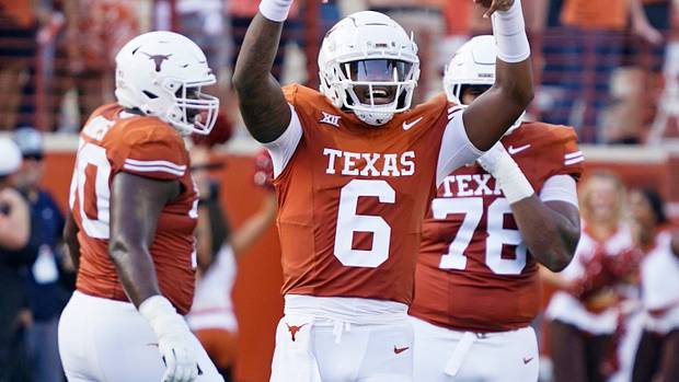 Texas Longhorns quarterback Maalik Murphy (6) reacts after throwing a touchdown pass during the first half against the Brigham Young Cougars at Darrell K Royal-Texas Memorial Stadium.