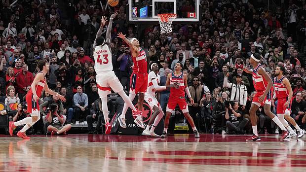 Toronto Raptors forward Pascal Siakam (43) shoots the ball at the basket as Washington Wizards forward Kyle Kuzma (33) goes for the block during the fourth quarter at Scotiabank Arena.