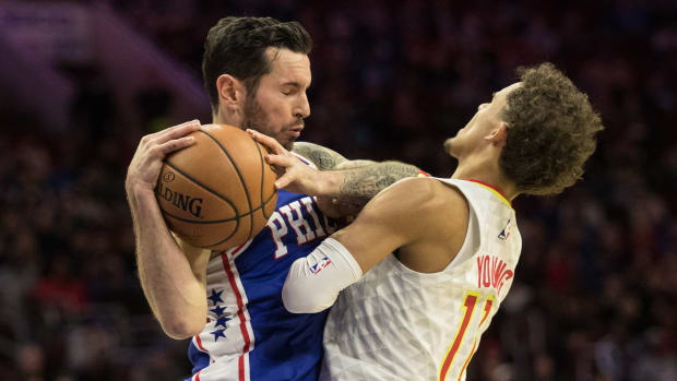 Philadelphia 76ers guard JJ Redick (17) and Atlanta Hawks guard Trae Young (11) collide during the second quarter at Wells Fargo Center.