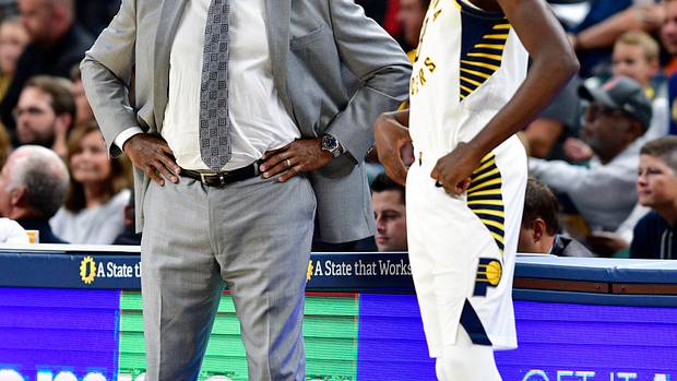 Justin Holiday with Nate McMillan.
