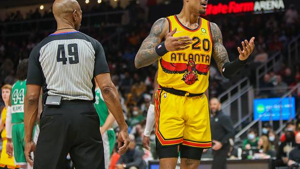 Atlanta Hawks forward John Collins reacts to a foul call during a game against the Boston Celtics.