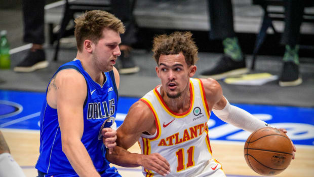 Dallas Mavericks guard Luka Doncic (77) defends against Atlanta Hawks guard Trae Young (11) during the first quarter at the American Airlines Center.
