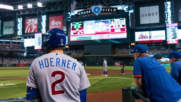 Sep 17, 2023; Phoenix, Arizona, USA; Chicago Cubs infielder Nico Hoerner (2) and manager David Ross (3) watch on from the corner of the dugout in the second inning against the Arizona Diamondbacks at Chase Field. Mandatory Credit: Allan Henry-USA TODAY Sports  
