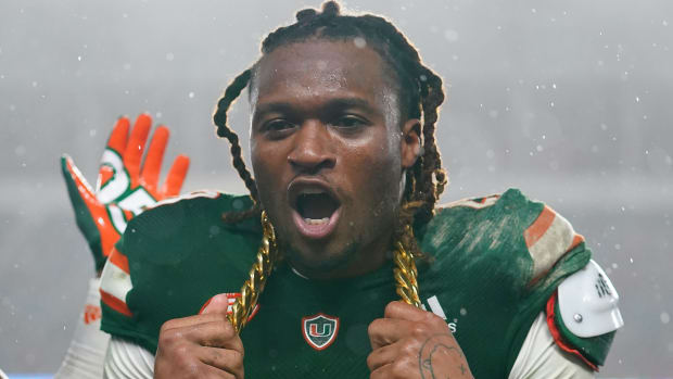 Nov 20, 2021; Miami Gardens, Florida, USA; Miami Hurricanes cornerback Marcus Clarke (28) celebrates with the turnover chain after recovering the fumble of Virginia Tech Hokies quarterback Braxton Burmeister (not pictured) during the second half at Hard Rock Stadium.