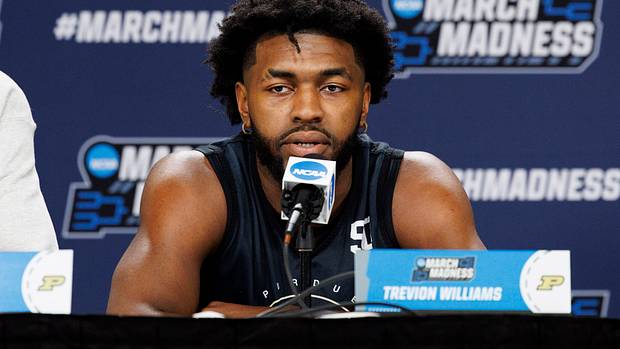 Purdue Boilermakers' Trevion Williams (50) answers questions during practice before the first round of the 2022 NCAA Tournament at Fiserv Forum.