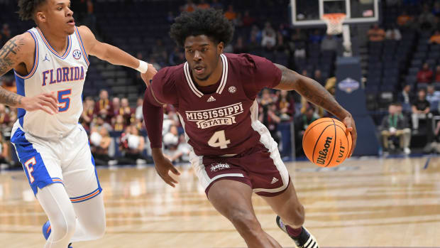 Mississippi State Bulldogs guard Cameron Matthews dribbles the ball.