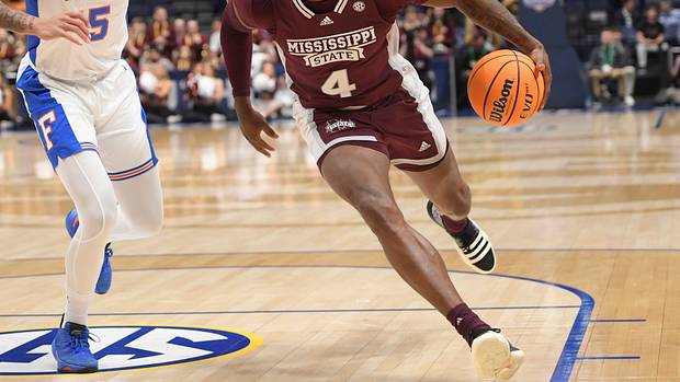 Mississippi State Bulldogs guard Cameron Matthews dribbles the ball.