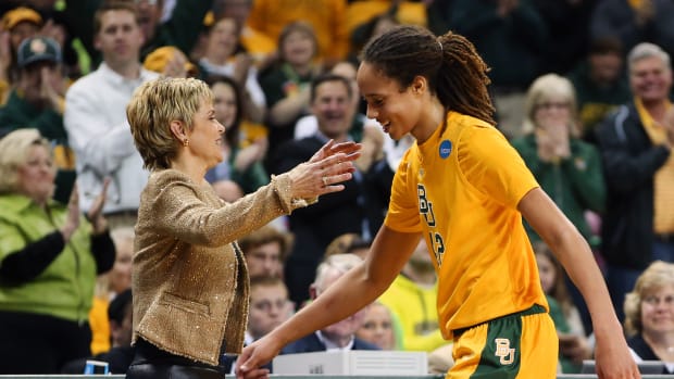 Baylor Bears center Brittney Griner (42) greets head coach Kim Mulkey after coming out of the game during the second half against the Florida State Seminoles during the second round of the 2013 NCAA women's tournament