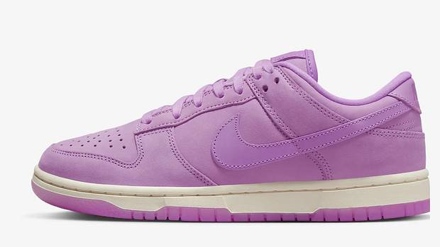 Side view of pink and blue Nike Dunk sneakers.