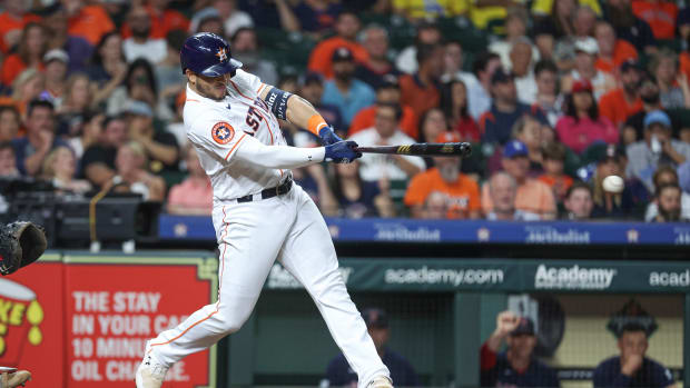 Aug 22, 2023; Houston, Texas, USA; Houston Astros designated hitter Yainer Diaz (21) hits an RBI single during the seventh inning against the Boston Red Sox at Minute Maid Park. Mandatory Credit: Troy Taormina-USA TODAY Sports  