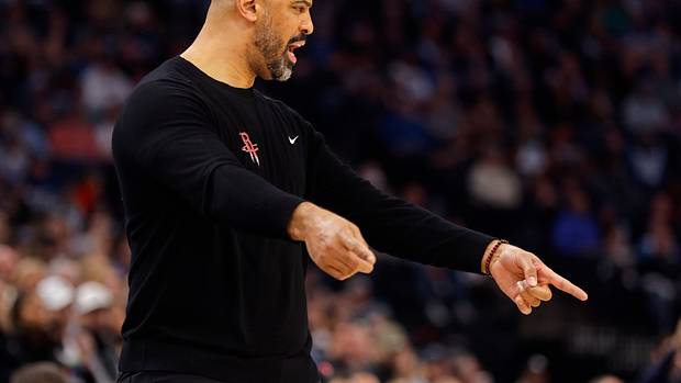 Rockets head coach Ime Udoka questions a referee as his team plays the Minnesota Timberwolves in the first quarter at Target Center.