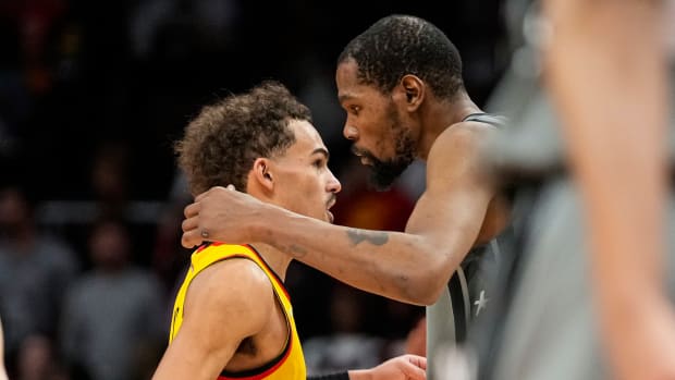 Apr 2, 2022; Atlanta, Georgia, USA; Atlanta Hawks guard Trae Young (11) (left) and Brooklyn Nets forward Kevin Durant (7) react after the Hawks defeated the Nets at State Farm Arena.