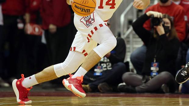 Wisconsin forward Carter Gilmore dribbling the basketball during a game.