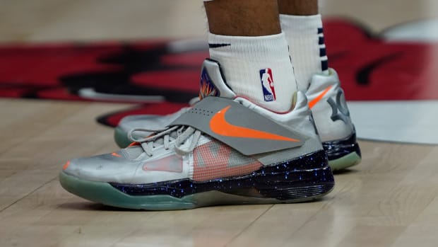 Kevin Durant's silver and orange Nike sneakers.