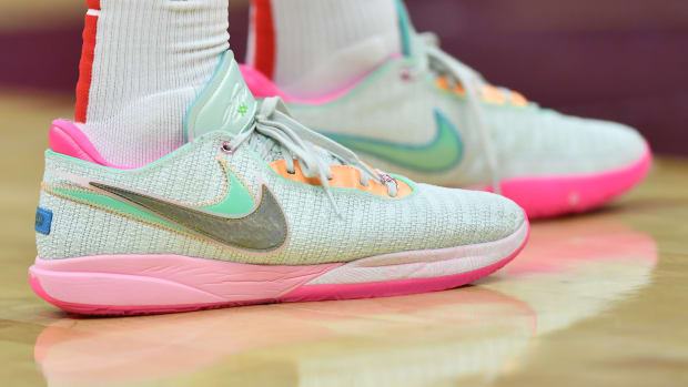 Light green and pink Nike LeBron shoes.