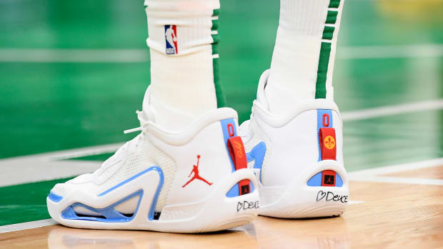 View of Jayson Tatum's white and blue Jordan sneakers.